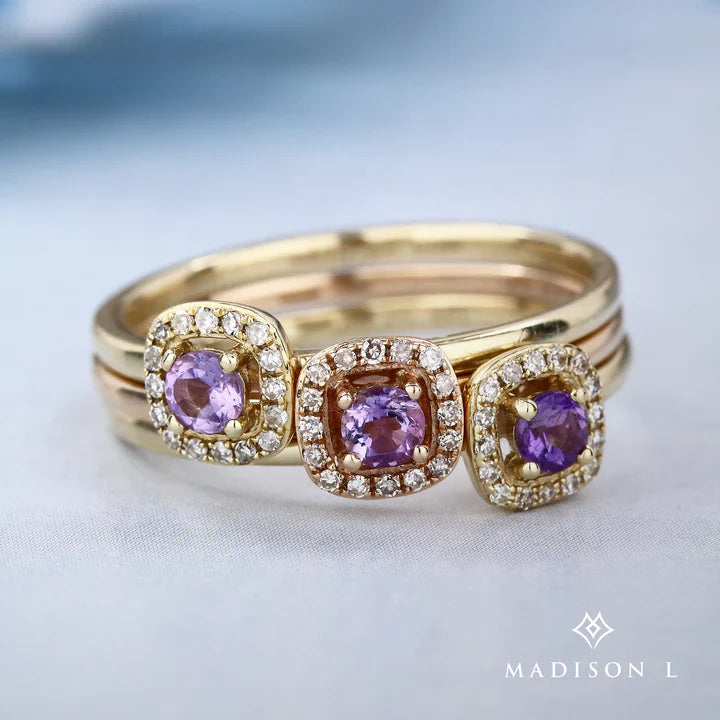 Gold ring with round purple stones with diamond halo