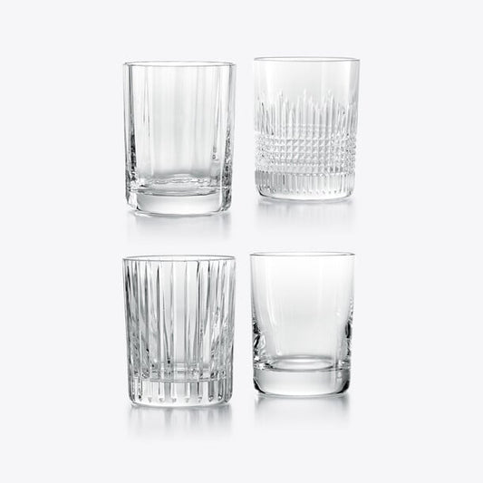4 clear crystal whisky tumblers with different textures against a white background