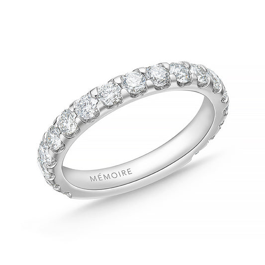 Memoire white gold three quarters diamond wedding band against a white background