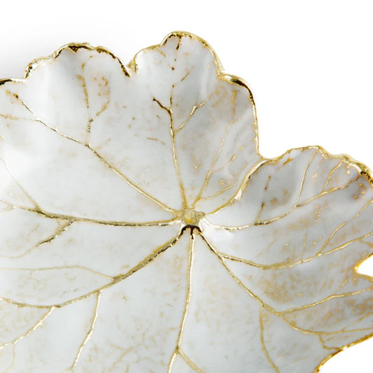 white Geranium catch-all dish with yellow gold filigree against a white background