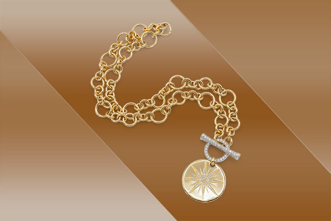 Gold image with round pendant sitting on gold background