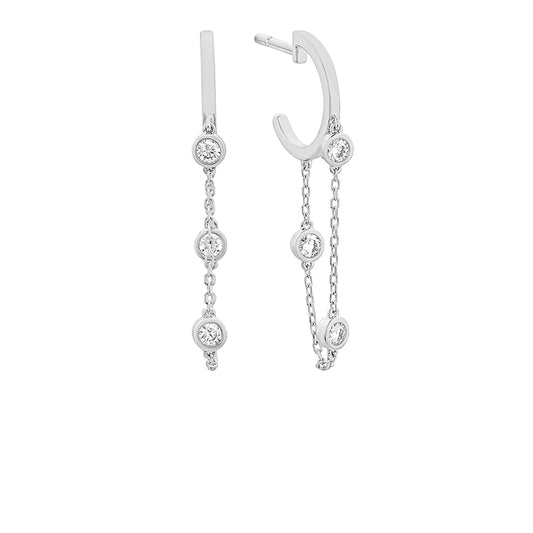 White Gold Diamond Dangle Earrings against a white background