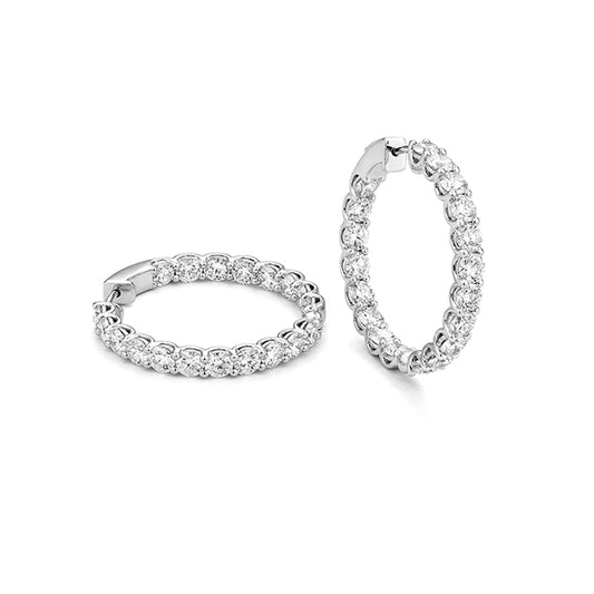 White Gold Diamond Hoop Earrings against a white background