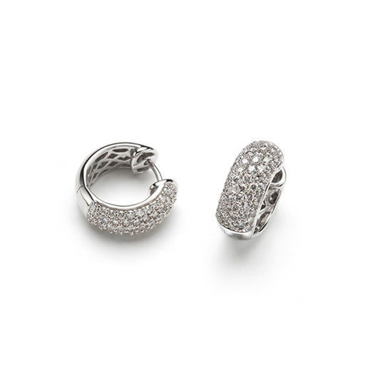 White Gold Pave Diamond Huggie Earrings against a white background