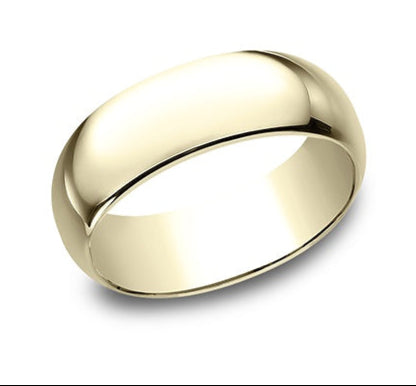 yellow gold dome wedding band against a white background