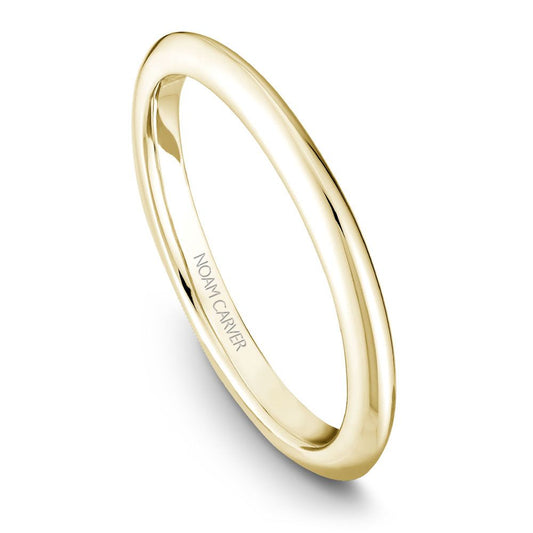 Thin yellow gold Noam Carver wedding band against a white background