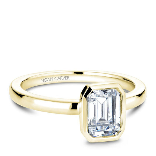 Noam Carver Yellow Gold Emerald Bezel Engagement Ring against a white background