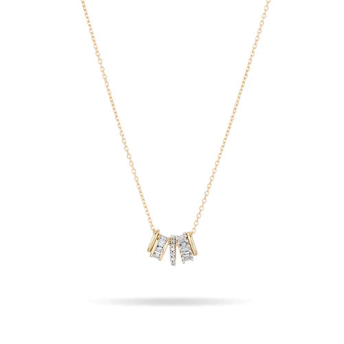 Yellow gold necklace with round diamond and gold charms of varying thickness against a white background