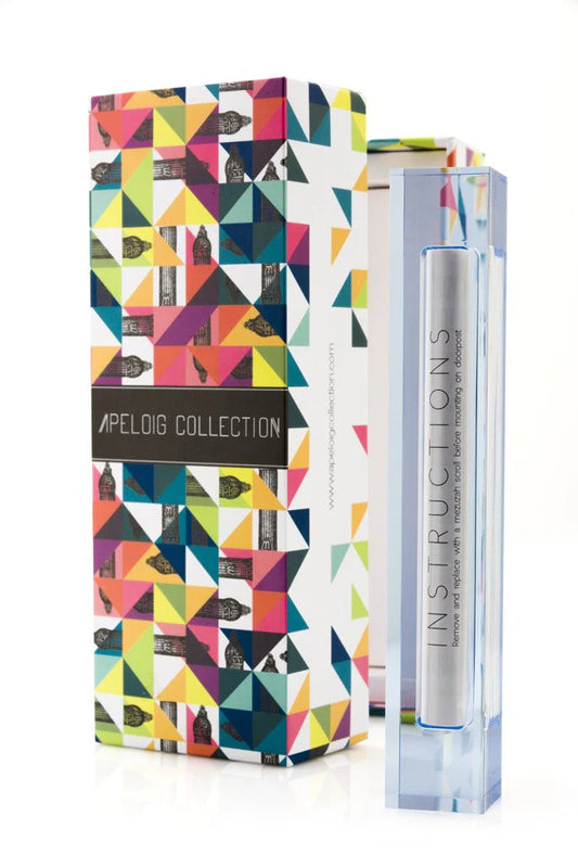 light blue mezuzah beside a multi-colored box against a white background