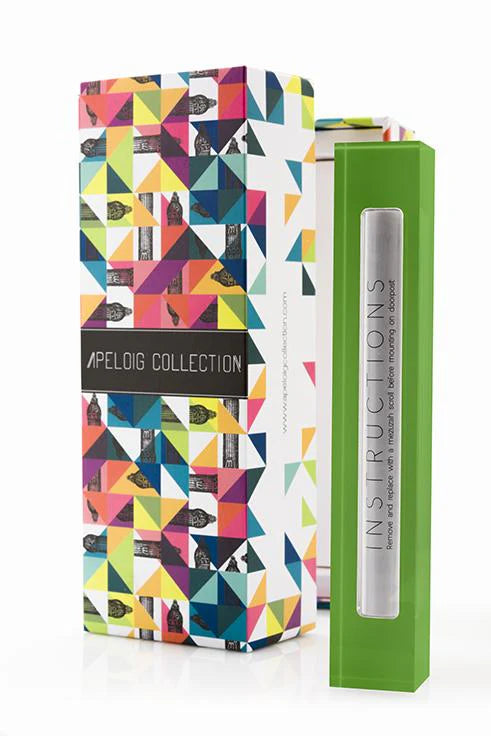 green mezuzah beside a multi-colored box against a white background
