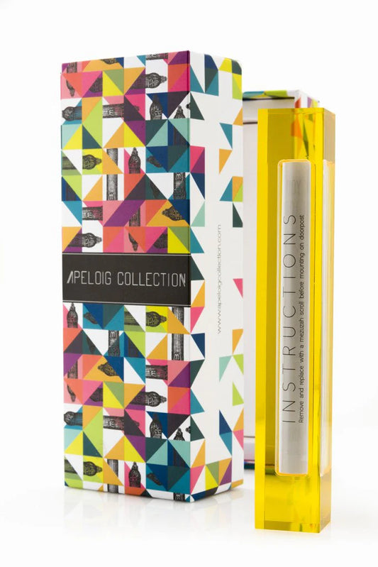yellow mezuzah next to a multi-colored box against a white background