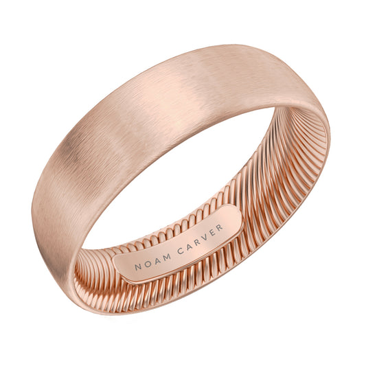 Noam Carver wide rose gold brushed wedding band against a white background