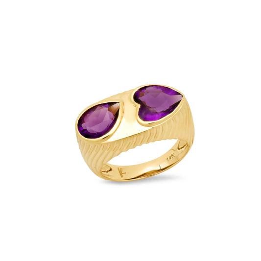 yellow gold ring with an amethyst tear drop and heart against a white background