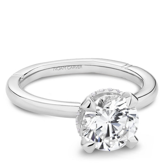 Noam Carver platinum engagement ring with a hidden halo of smaller diamonds against a white background