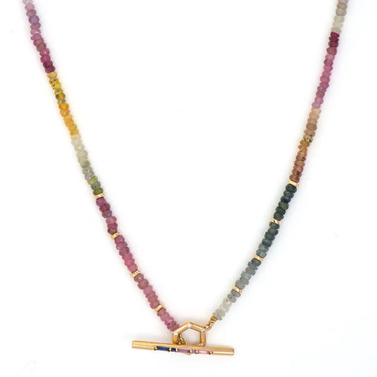 yellow gold and multi-colored Sea Sapphire Toggle Necklace against a white background