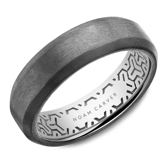 Noam Carver tantalum wedding band that looks brushed silver-colored with geometric shapes inside the band against a white background