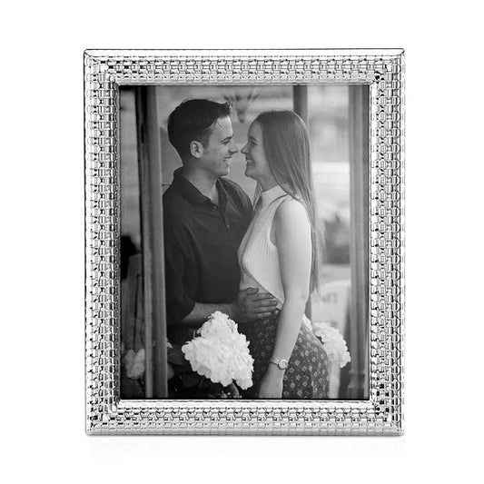watchband silver picture frame with an image of a couple standing close together and set against a white background